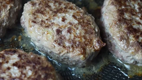 Meat cutlets are fried in a pan Stock Footage 170217427