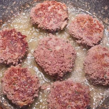 Meat cutlets are fried Stock Photos