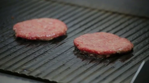 Meat cutlets beef fried on a stove and turn over with a spatula Stock Footage 127201523