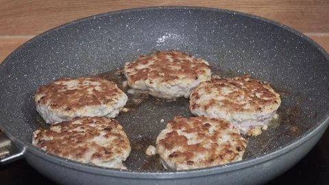 Meat cutlets being fried on the pan. 18x fast forward Stock Footage 84197615