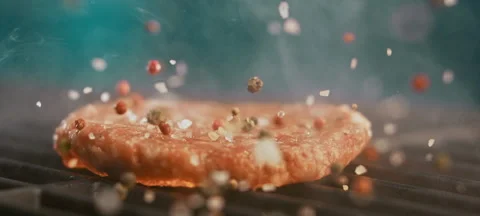 Meat cutlets falling in hot flames Stock Footage 311833868