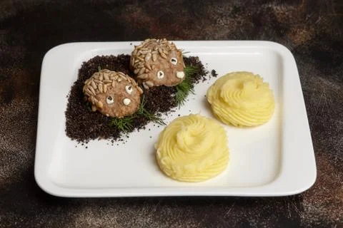 Meat cutlets in hedgehog shape and mashed potato. Kids menu Stock Photos