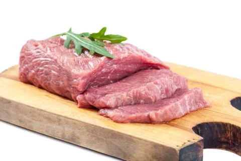 Meat on a cutting board on white background. Stock Photos