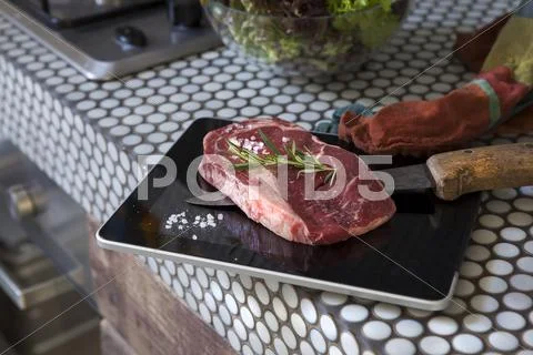 Meat on digital tablet with knife Stock-Fotos