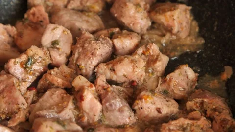 Meat dinner. Stirring in a pan. Sliced beef in its own juice, with spices and Stock Footage 197437521