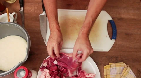 Meat dish - chopping t-bone steak on small chunks Stock Footage 44777398