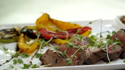 Meat Dish with Grilled Vegetables Stock Footage 132217239