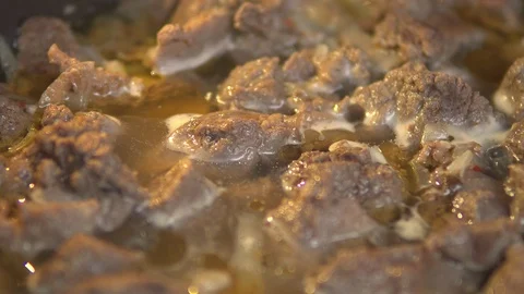 Meat dishes. Meat is stewed in water Stock Footage 101351069