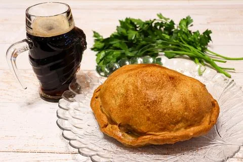 Meat in dough with beer on the table Foto stock