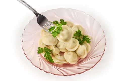 Meat dumpling on fork on blurred background of dish dumplings Stock Photos