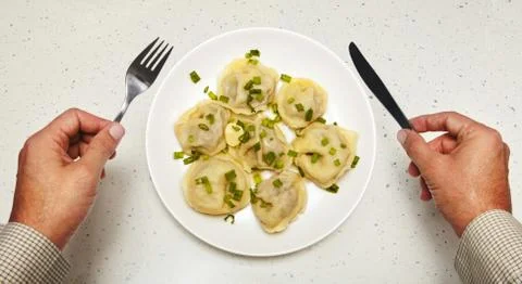 Meat dumplings in front of visitor Stock Photos
