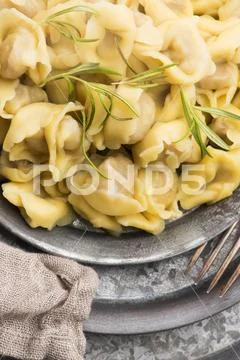 Meat Dumplings - russian boiled pelmeni in plate Stock Photos