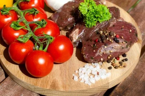 Meat with fresh vegetables. Stock Photos