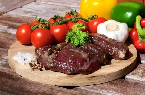 Meat with fresh vegetables. Stock Photos