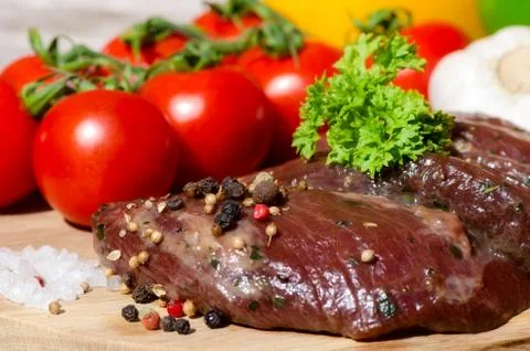 Meat with fresh vegetables. Stock Photos