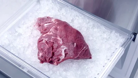 Meat in fridge in slow motion Stock Footage 73390829