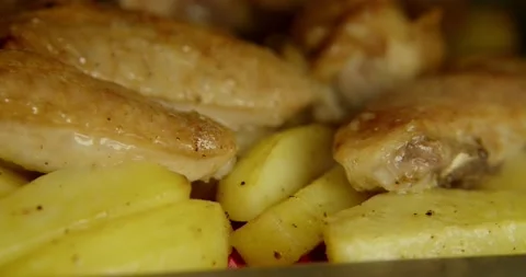 Meat is fried with chopped potatoes and onions. Smooth camera passage shooting Stock Footage 160820962