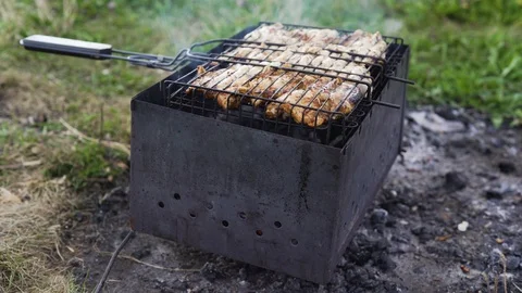 Meat is fried on coals on a brazier 库存影片 93745308