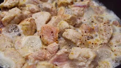 The meat is fried in a frying pan. Close-up. Video stock 94540206