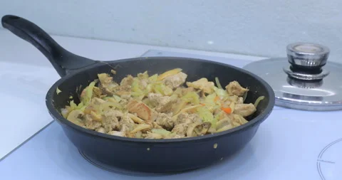 Meat fried in a frying pan Video stock 145712396