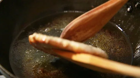 Meat is fried in a frying pan Stock Footage 146842356