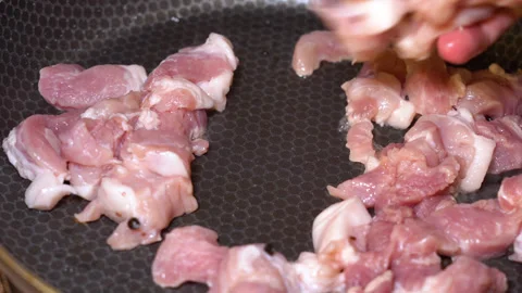 Meat is fried in a frying pan Stock Footage 248087863