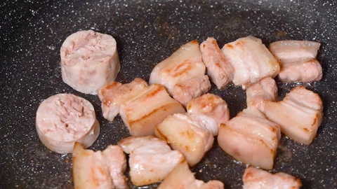 Meat is fried in a frying pan Stock Footage 255399087