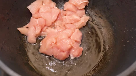Meat is fried in a frying pan. High quality 4k footage Stock Footage 248439633
