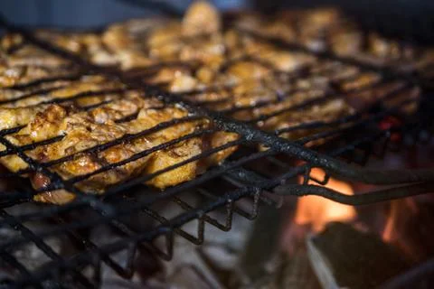 The meat is fried on the grill on an open fire 스톡 사진