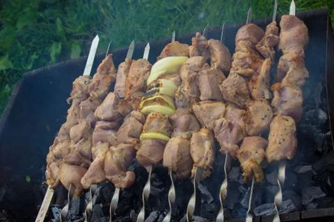 The meat is fried on the grill. Selective focus. Stock Photos