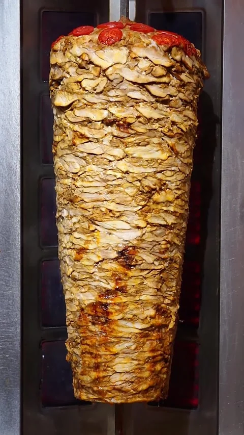 Meat is fried to make Shawarma (Doner, Kebab) Stock Footage 248260650