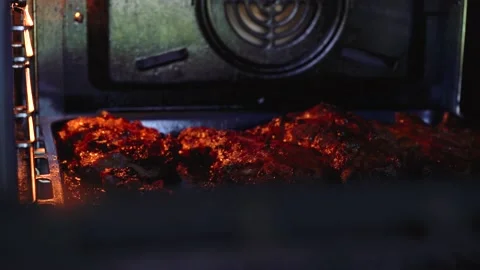 Meat is fried in the oven Stock Footage 135828713