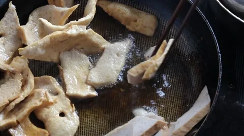 Meat fried in a pan Stock Footage 64578770