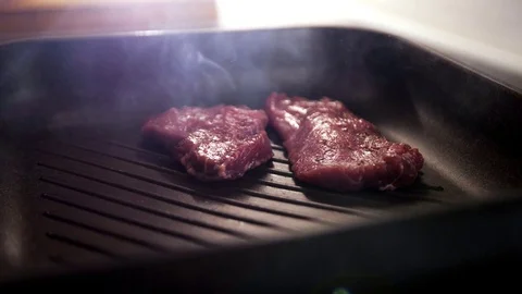 Meat is fried in a pan. Stock Footage 129290214