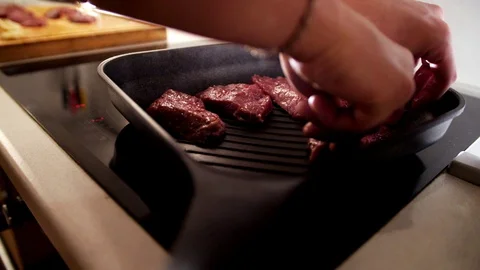 Meat is fried in a pan. Stock Footage 129290230