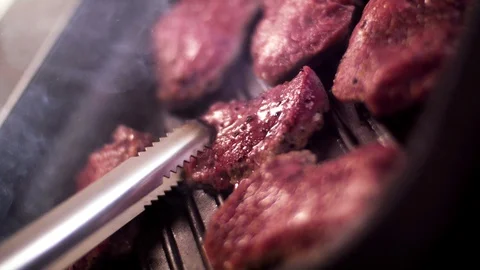 Meat is fried in a pan. Stock Footage 129290264