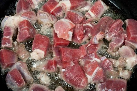 Meat is fried in a pan Stock Photos