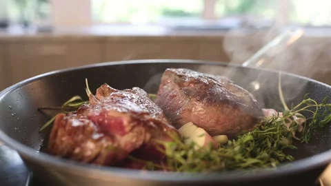 Meat is fried in a pan with spices and herbs Stock Footage 273674255