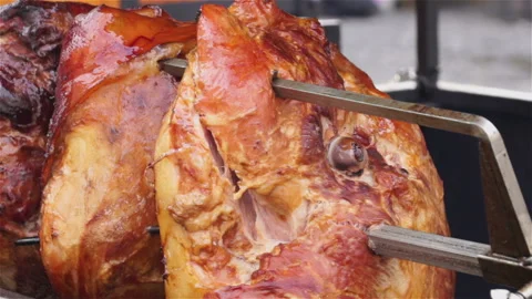 Meat fried on a rotating grill. Stock Footage 106111384