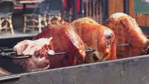 Meat fried on a rotating grill. Stock Footage 106111403