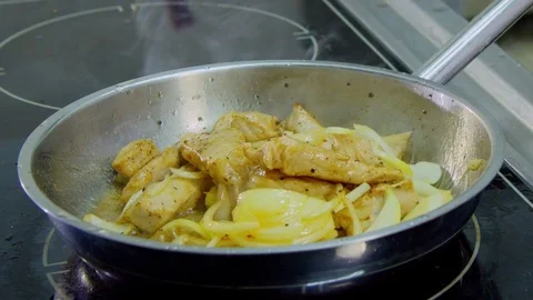 Meat fried in a skillet Stock Footage 70981092