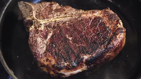 The meat is frying in the pan Stock Footage 130988752