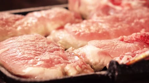 Meat on glill pan 4K Stock Footage 137267534