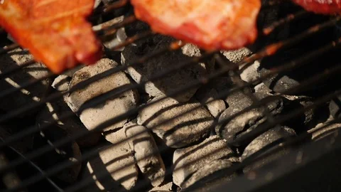 Meat on the grill being cooked by white coals Stock Footage 115058752