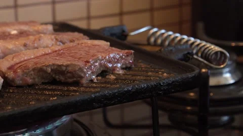 Meat on a grill Stock Footage 130267261