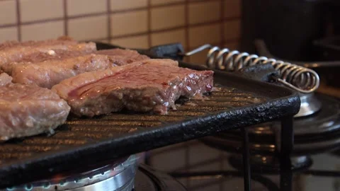 Meat on a grill Stock Footage 130267554