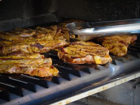 Meat on grill Stock Photos