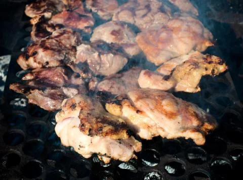 Meat on grill Stock Photos