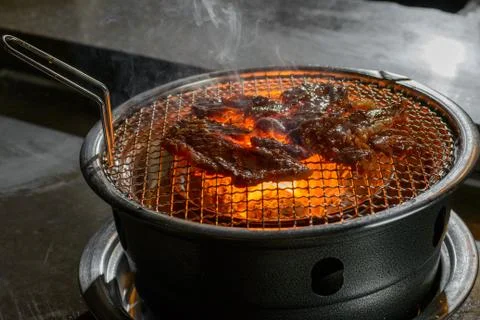 Meat on grill Stock Photos