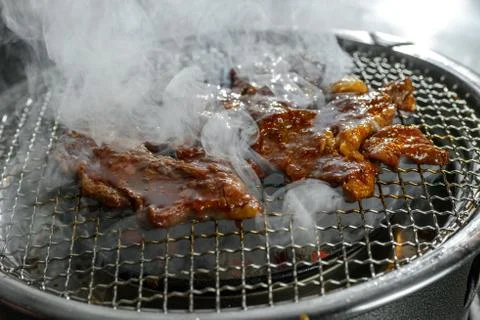 Meat on grill Stock Photos